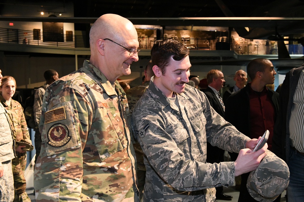 Gen. Arnold W. Bunch greets airman and civilians after Commander's Call