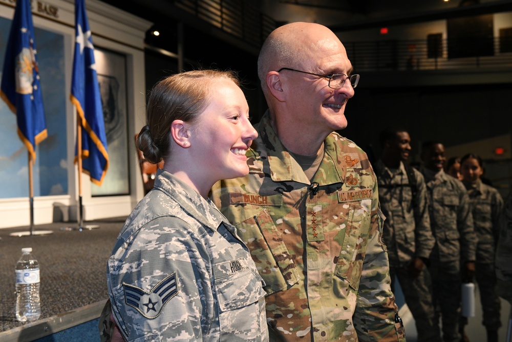 Gen. Arnold W. Bunch greets airman and civilians after Commander's Call
