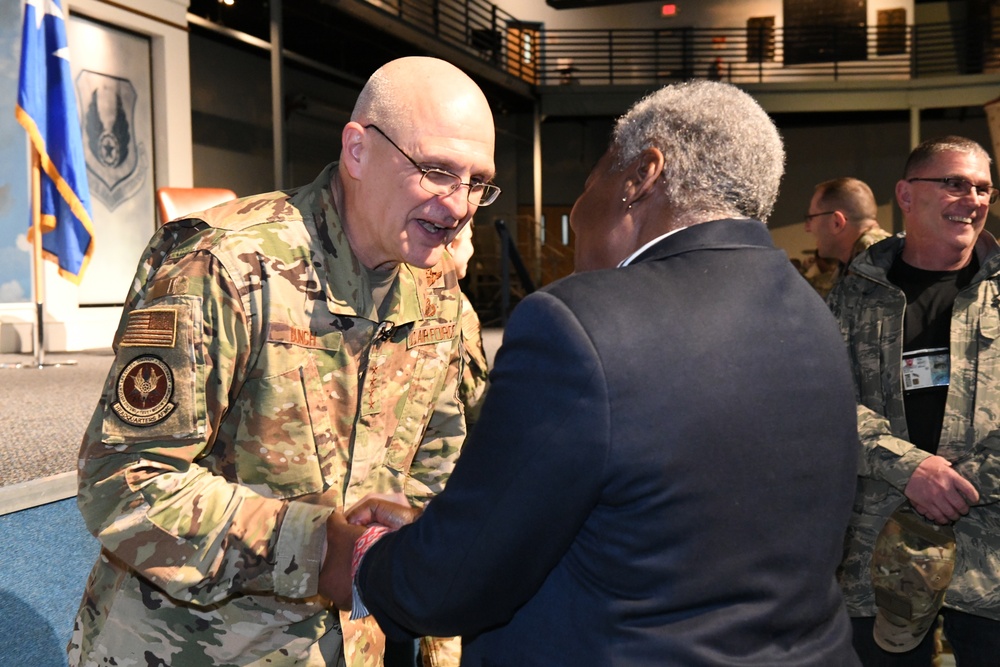 Gen. Arnold W. Bunch greets airman and civilians after Commander's Call
