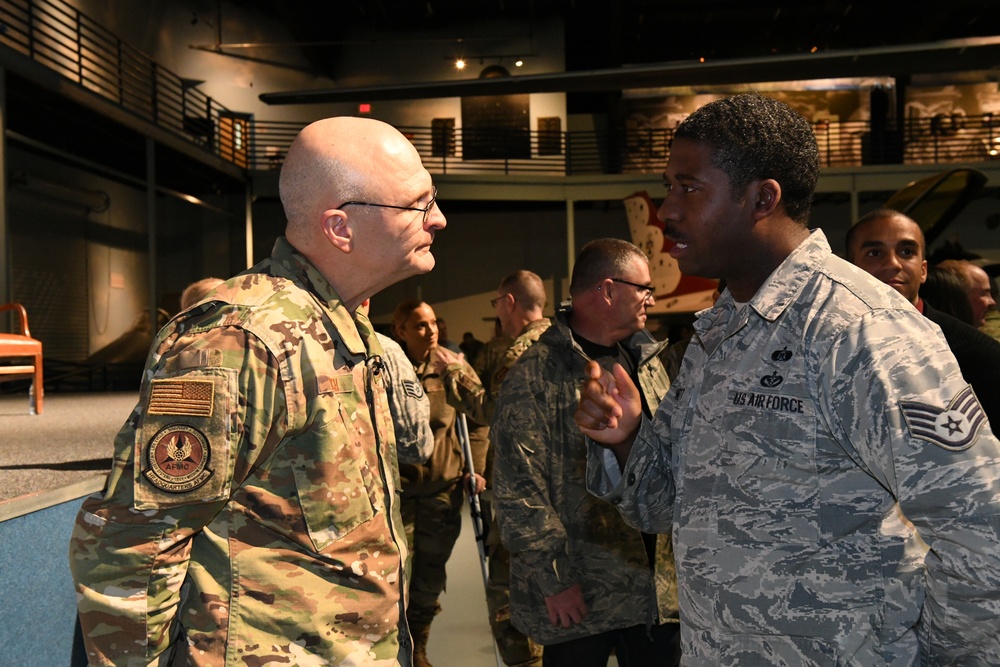Gen. Arnold W. Bunch greets airman and civilians after Commander's Call