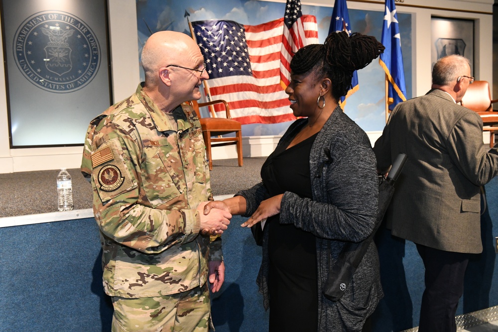 Gen. Arnold W. Bunch greets airman and civilians after Commander's Call