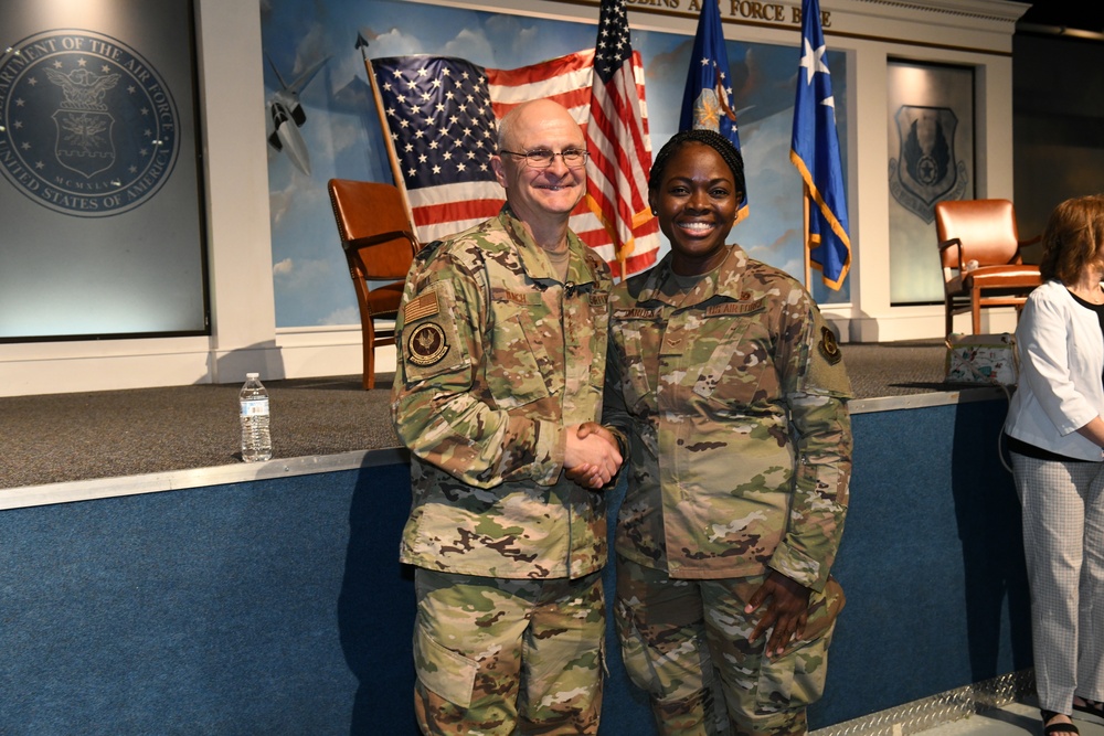 Gen. Arnold W. Bunch greets airmen and civilians after Commander's Call
