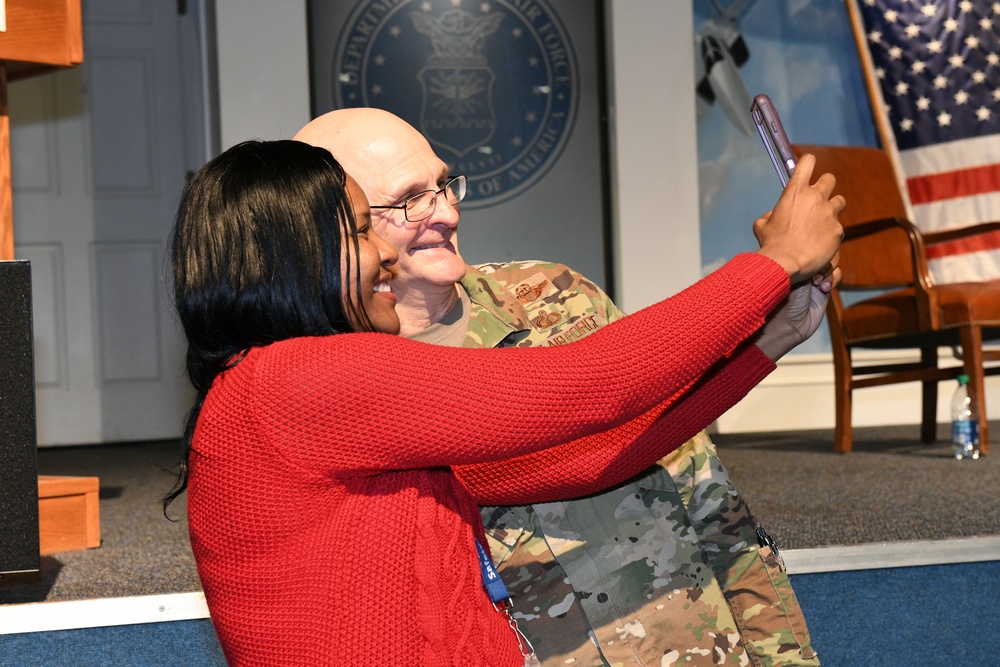 Gen. Arnold W. Bunch greets airmen and civilians after Commander's Call