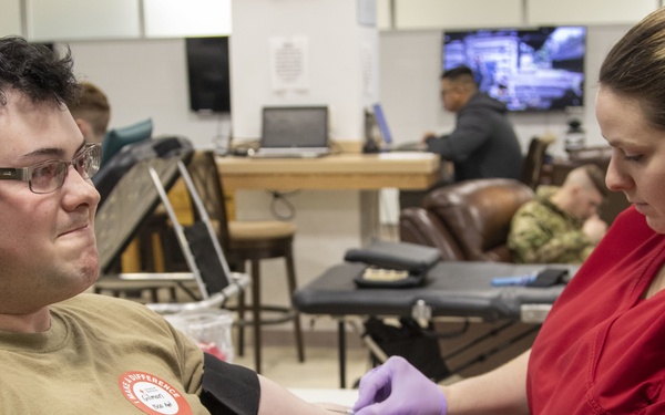 Warrior Brigade Soldier donates during Fort Drum BOSS blood drive.