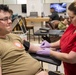 Warrior Brigade Soldier donates during Fort Drum BOSS blood drive.