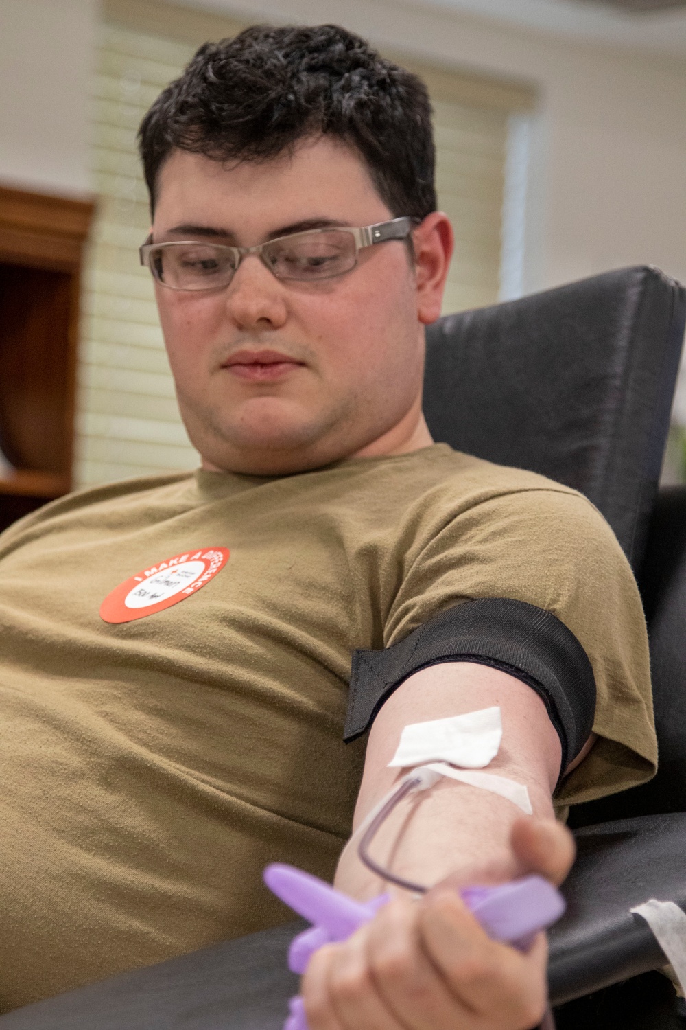 Warrior Brigade Soldier donates during Fort Drum BOSS blood drive.