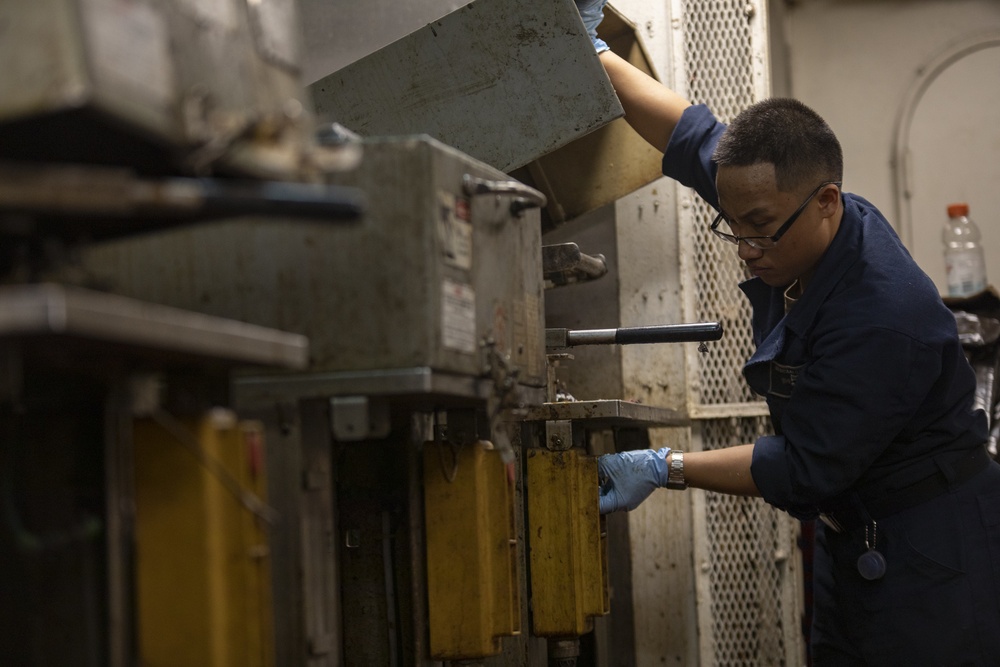 Sailor works in Plastic waste room