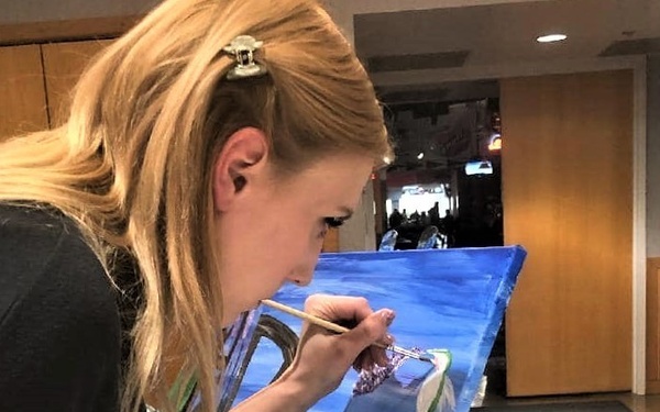 Fort McCoy community members create works of art at Sit, Sip, Paint event