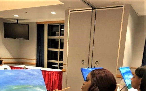 Fort McCoy community members create works of art at Sit, Sip, Paint event