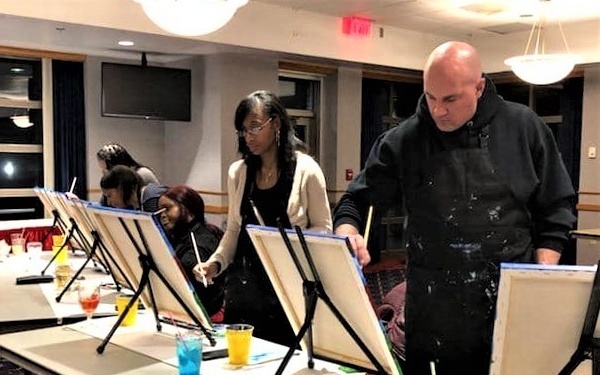 Fort McCoy community members create works of art at Sit, Sip, Paint event