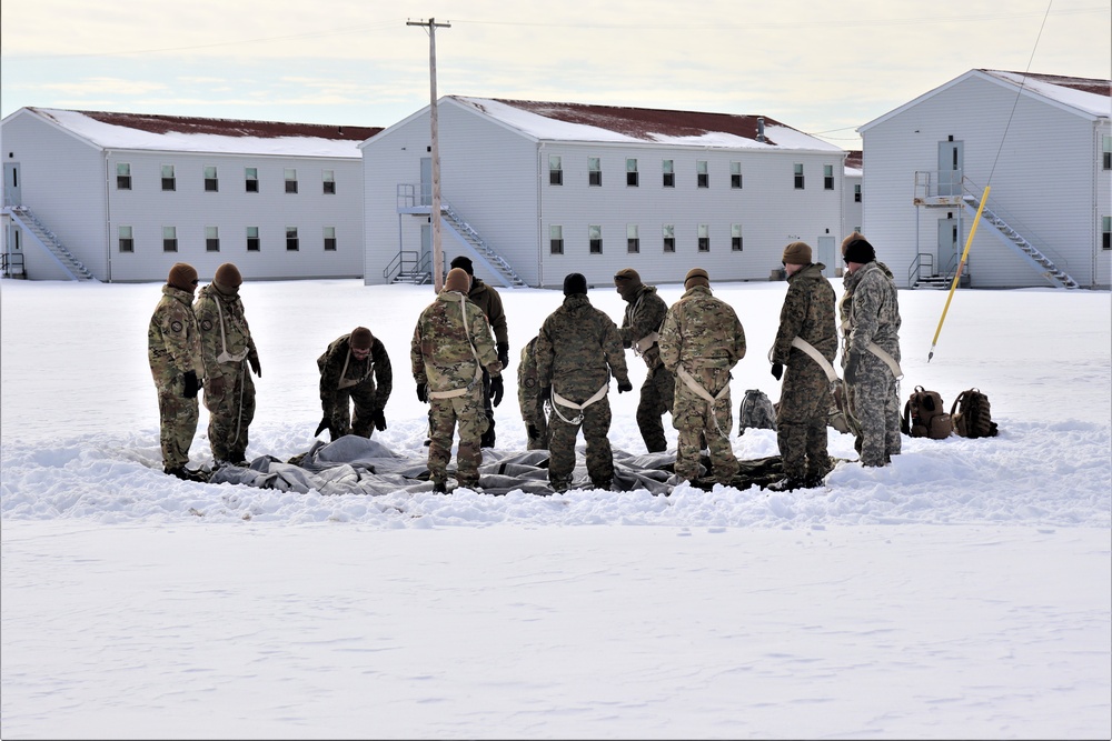 CWOC Class 20-04 students learn to build Arctic tent during training at Fort McCoy