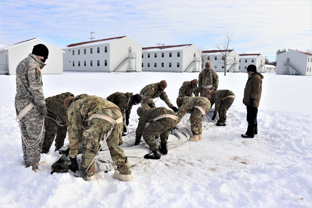 CWOC Class 20-04 students learn to build Arctic tent during training at Fort McCoy