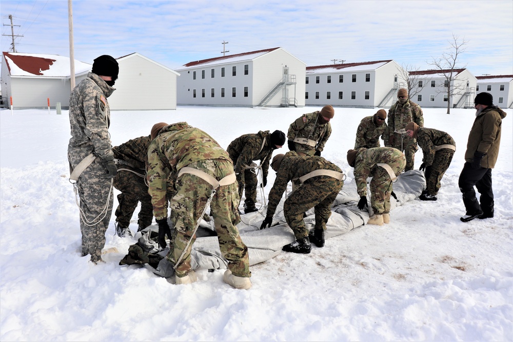 CWOC Class 20-04 students learn to build Arctic tent during training at Fort McCoy