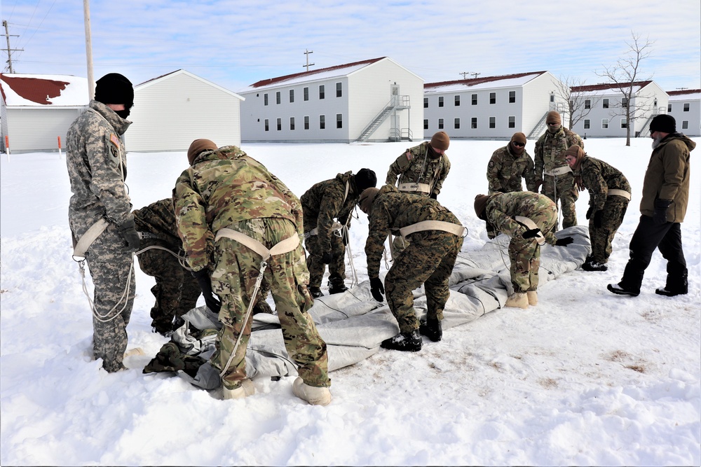 CWOC Class 20-04 students learn to build Arctic tent during training at Fort McCoy