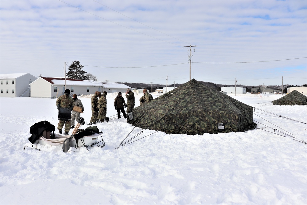 CWOC Class 20-04 students learn to build Arctic tent during training at Fort McCoy