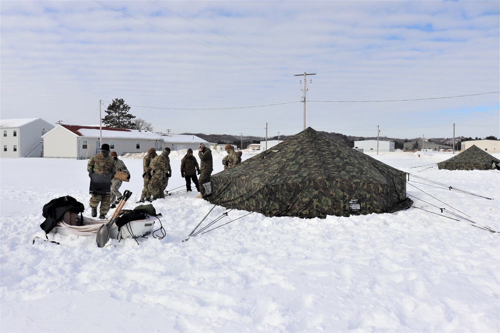 CWOC Class 20-04 students learn to build Arctic tent during training at Fort McCoy