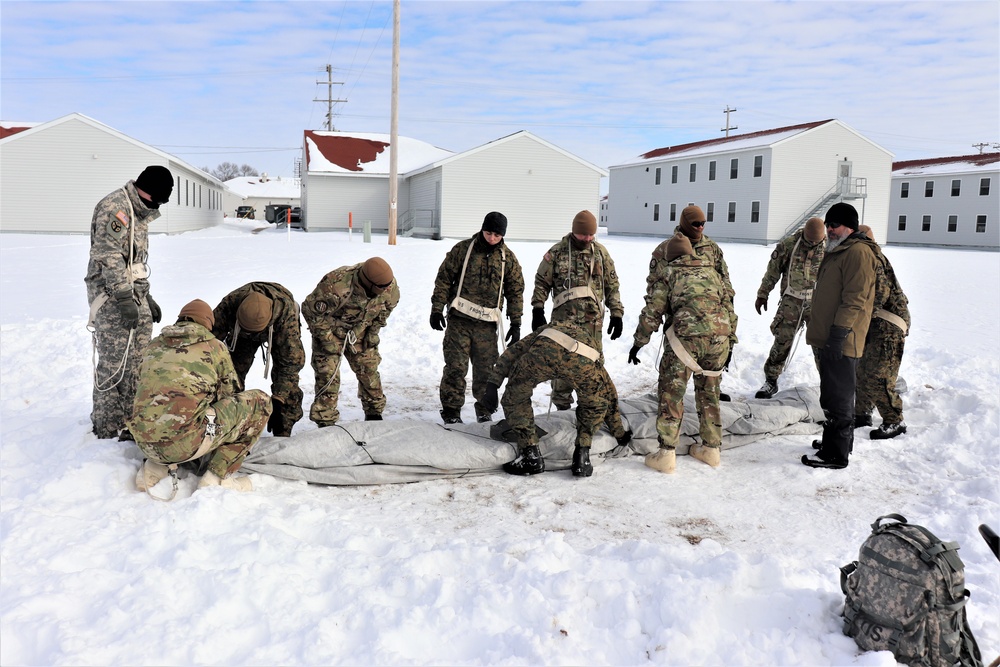 CWOC Class 20-04 students learn to build Arctic tent during training at Fort McCoy