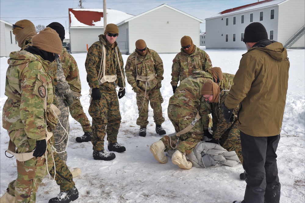 CWOC Class 20-04 students learn to build Arctic tent during training at Fort McCoy