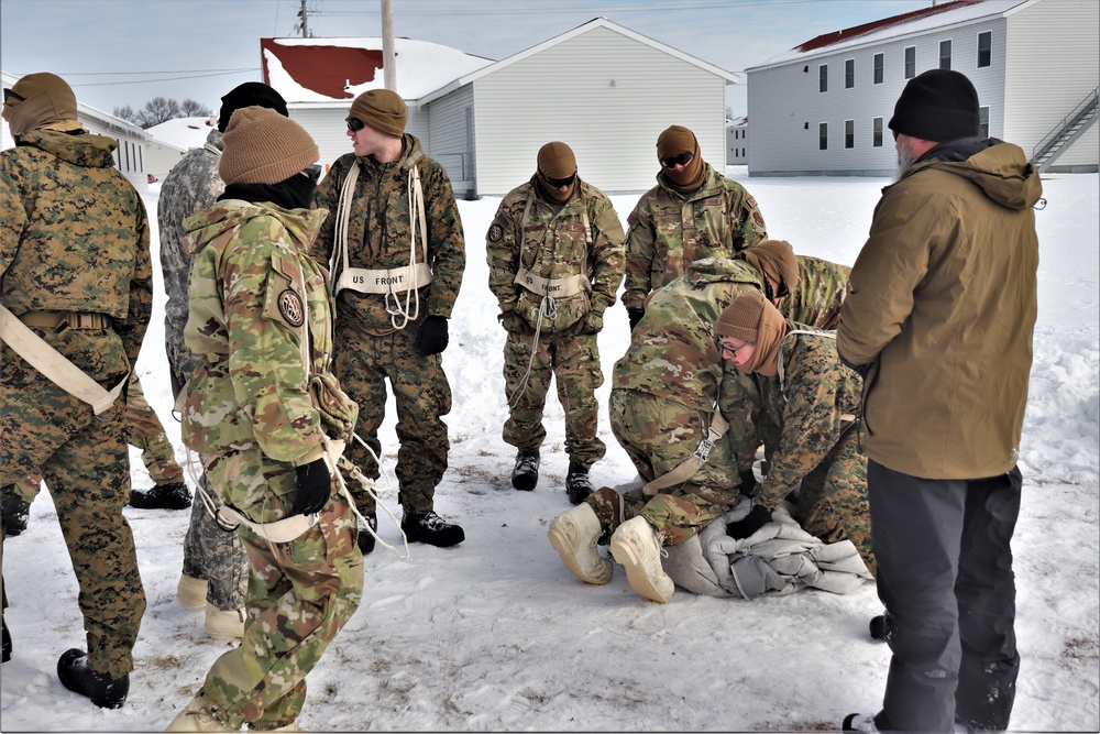 CWOC Class 20-04 students learn to build Arctic tent during training at Fort McCoy