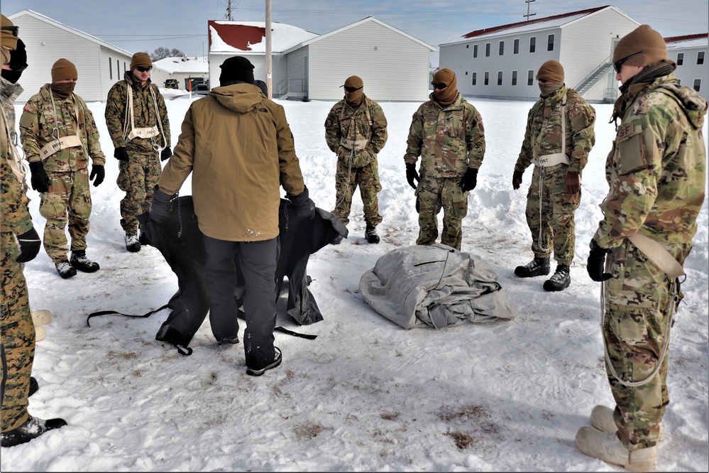 CWOC Class 20-04 students learn to build Arctic tent during training at Fort McCoy