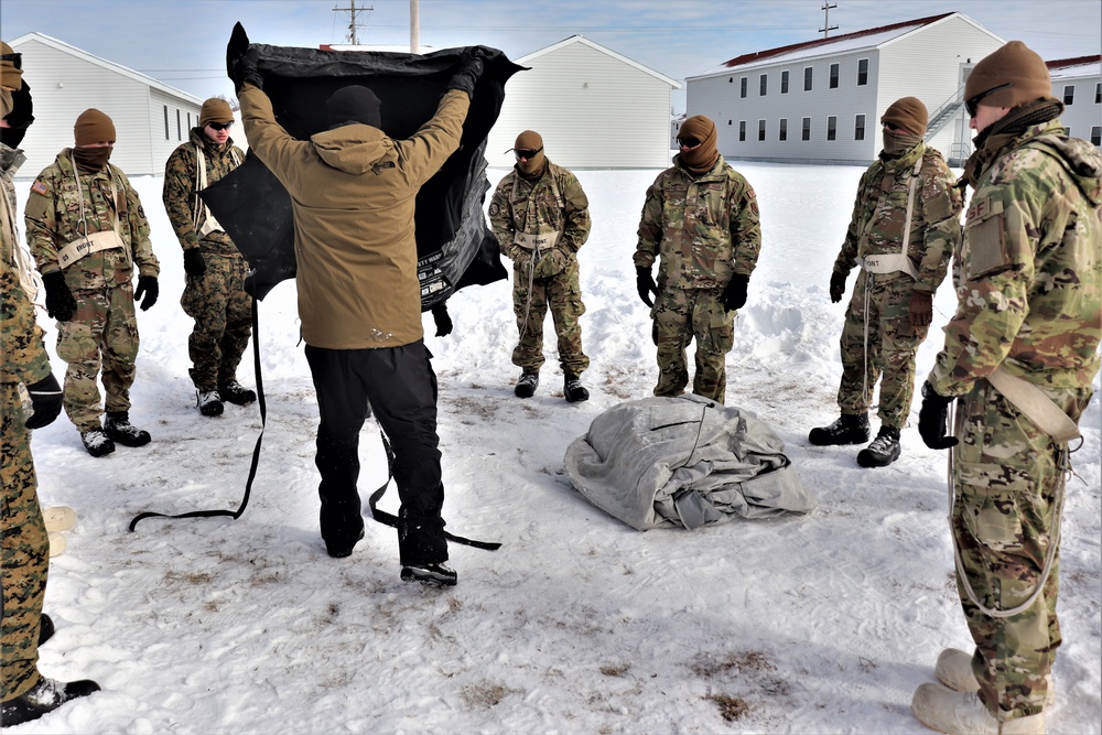 CWOC Class 20-04 students learn to build Arctic tent during training at Fort McCoy