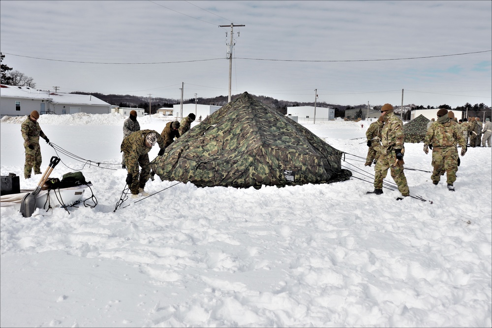 CWOC Class 20-04 students learn to build Arctic tent during training at Fort McCoy