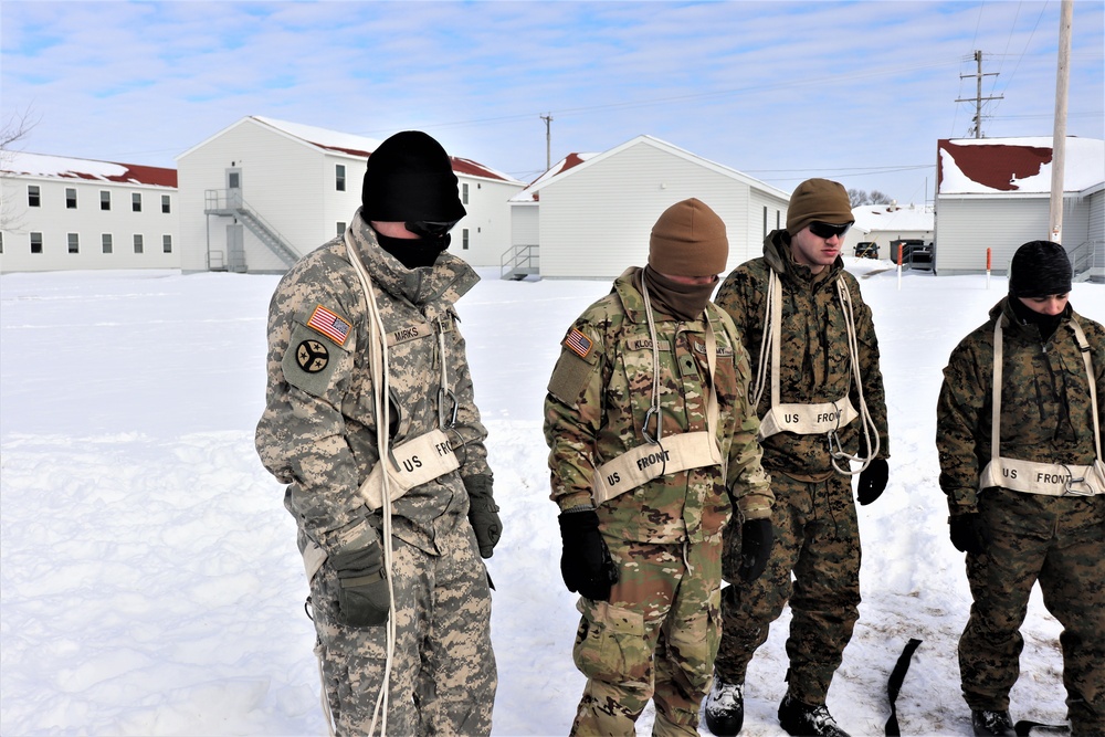 CWOC Class 20-04 students learn to build Arctic tent during training at Fort McCoy