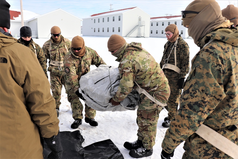 CWOC Class 20-04 students learn to build Arctic tent during training at Fort McCoy