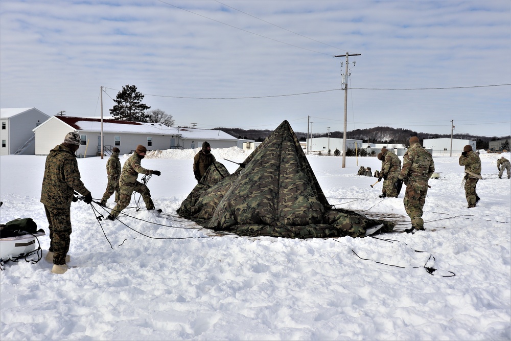 CWOC Class 20-04 students learn to build Arctic tent during training at Fort McCoy