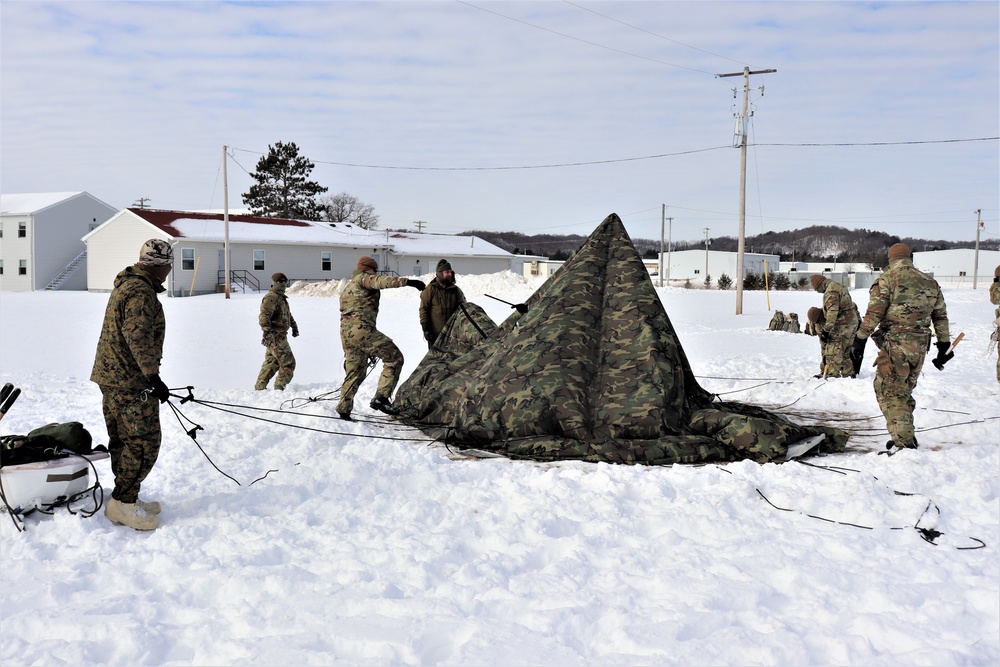 CWOC Class 20-04 students learn to build Arctic tent during training at Fort McCoy