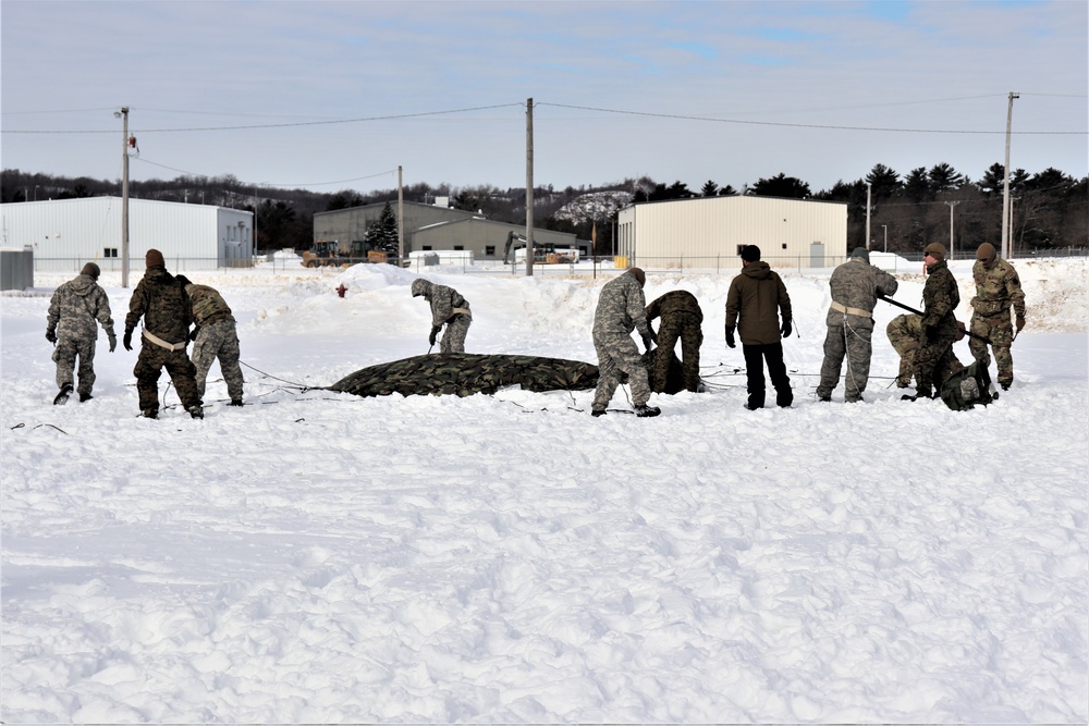 CWOC Class 20-04 students learn to build Arctic tent during training at Fort McCoy