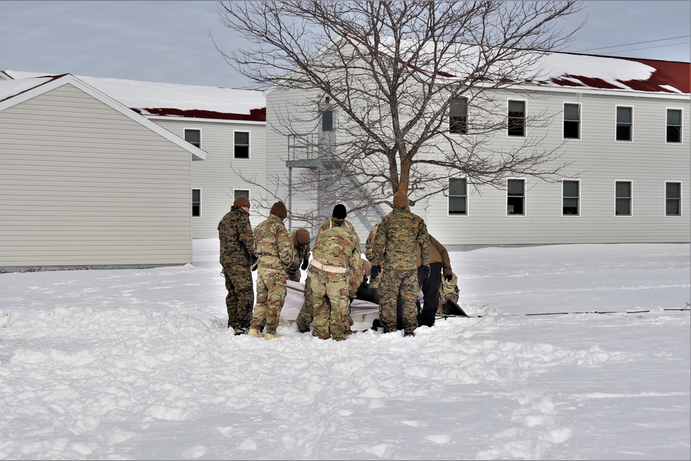 CWOC Class 20-04 students learn to build Arctic tent during training at Fort McCoy