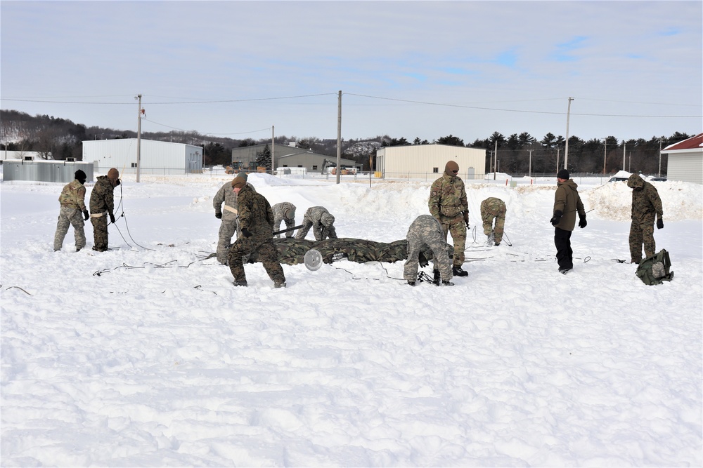 CWOC Class 20-04 students learn to build Arctic tent during training at Fort McCoy