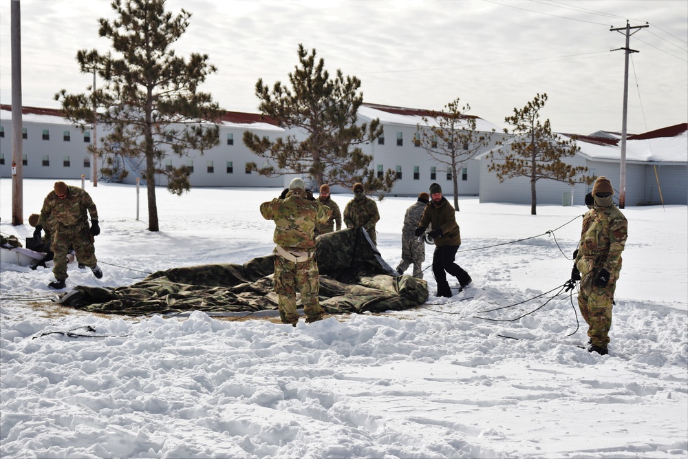 CWOC Class 20-04 students learn to build Arctic tent during training at Fort McCoy