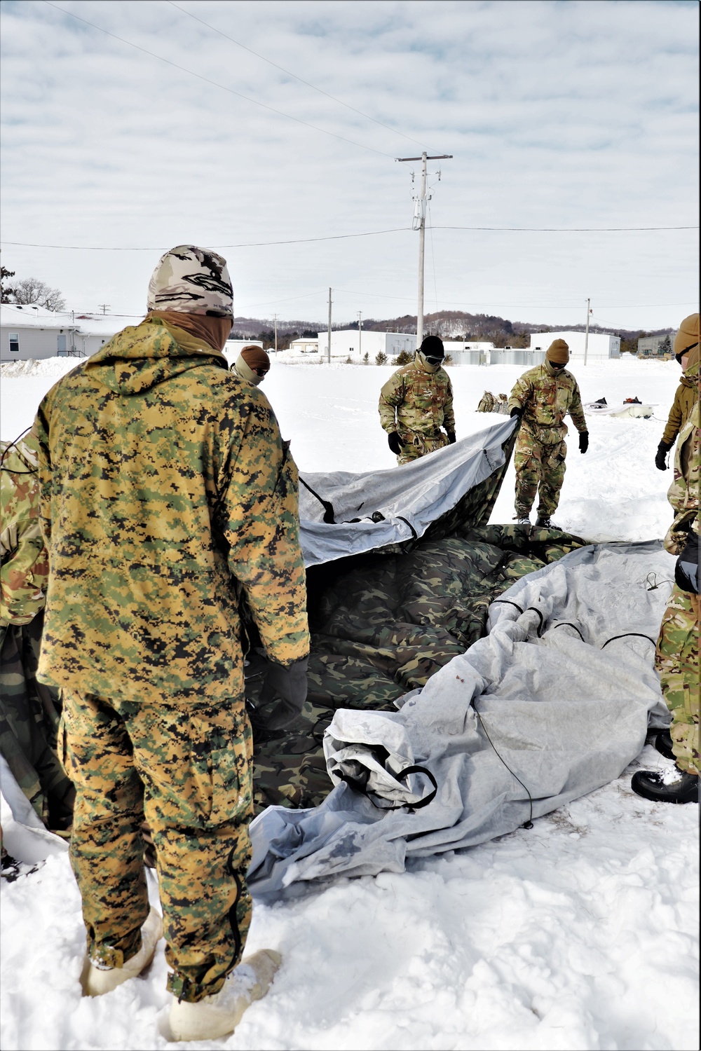 CWOC Class 20-04 students learn to build Arctic tent during training at Fort McCoy