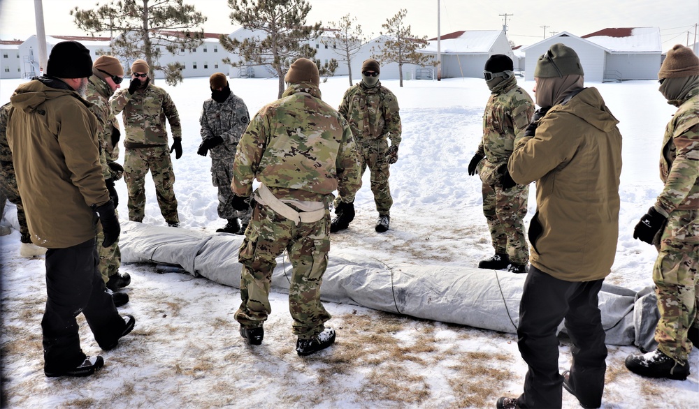 CWOC Class 20-04 students learn to build Arctic tent during training at Fort McCoy