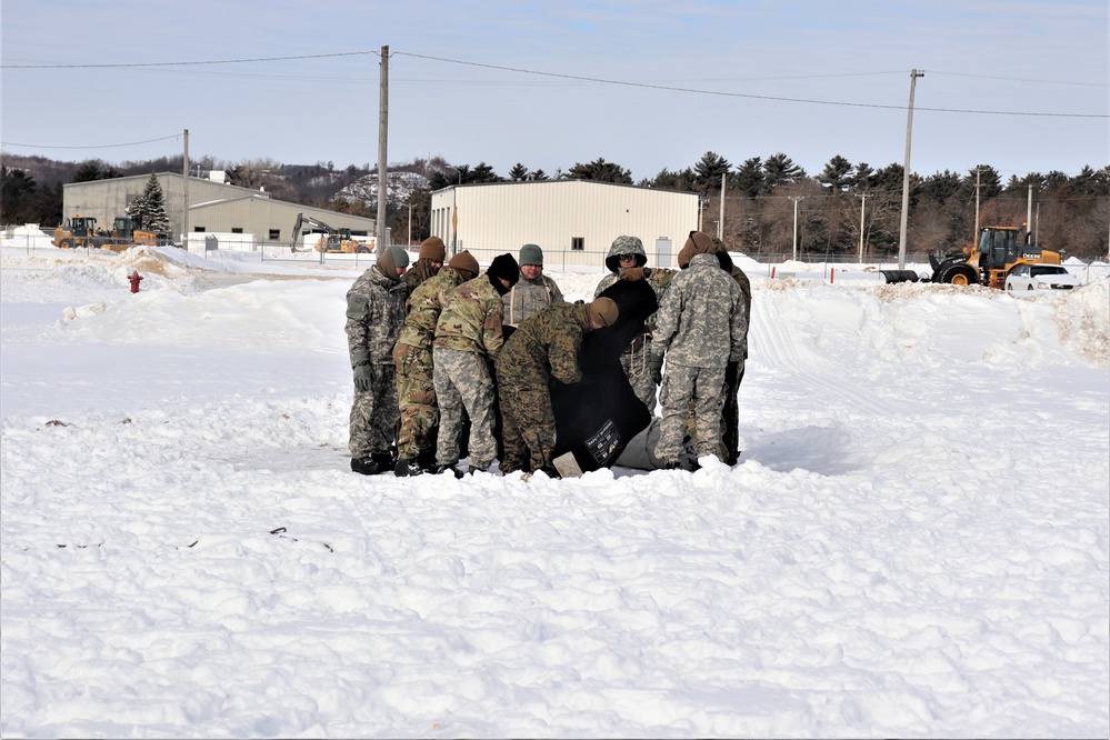 CWOC Class 20-04 students learn to build Arctic tent during training at Fort McCoy