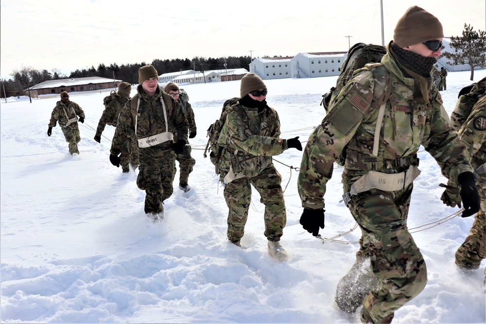 Fort McCoy CWOC Class 20-04 students practice pulling ahkio sled as a squad