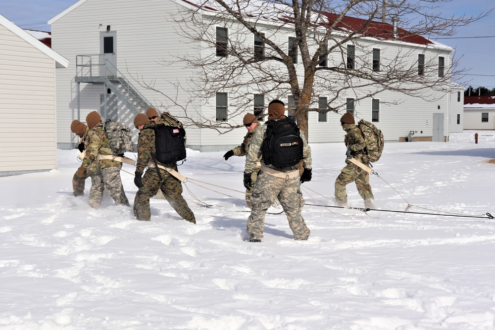 Fort McCoy CWOC Class 20-04 students practice pulling ahkio sled as a squad