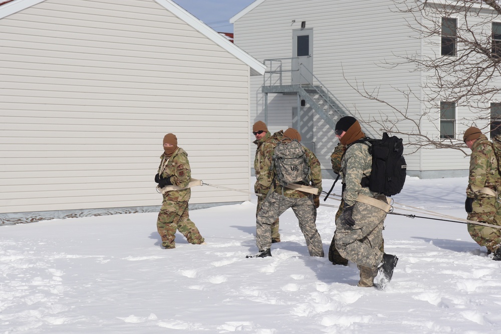 Fort McCoy CWOC Class 20-04 students practice pulling ahkio sled as a squad