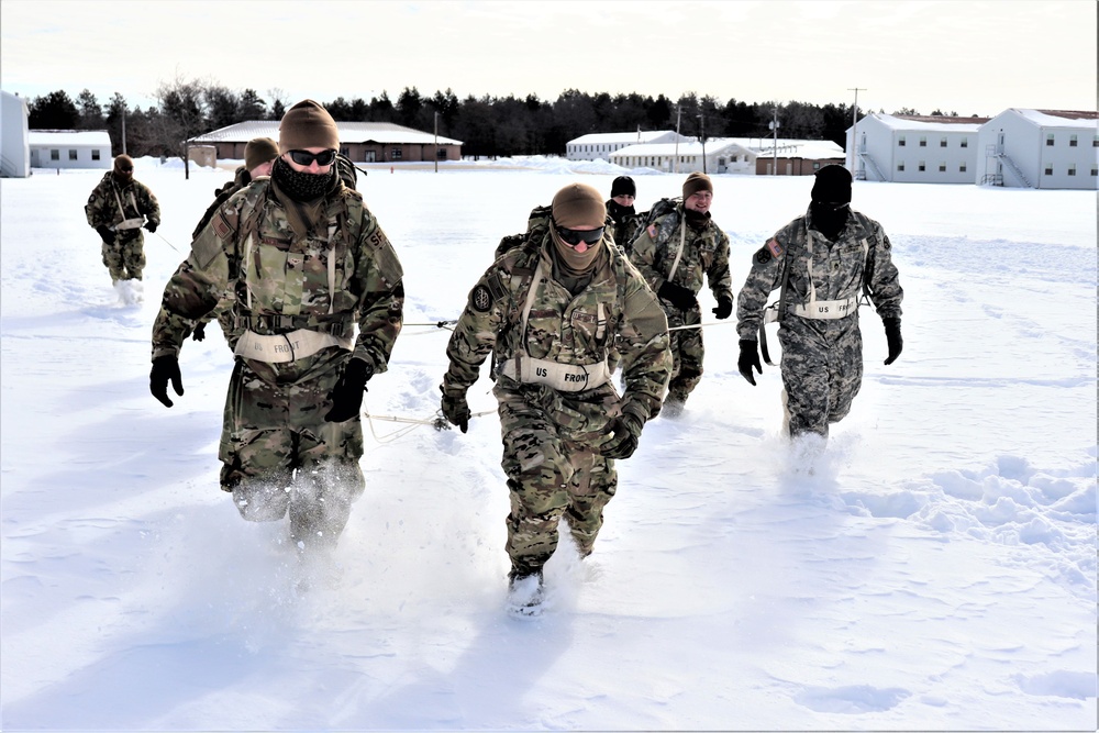 Fort McCoy CWOC Class 20-04 students practice pulling ahkio sled as a squad