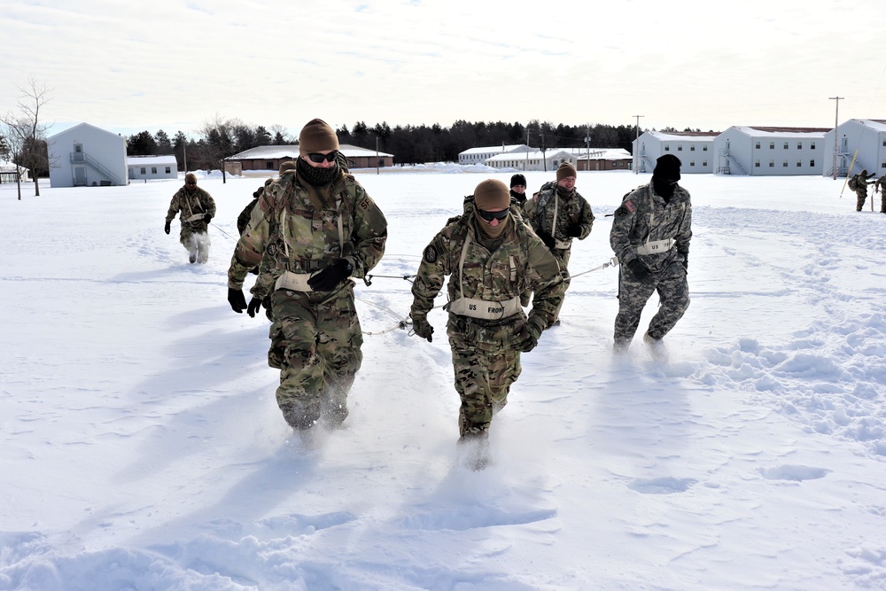 Fort McCoy CWOC Class 20-04 students practice pulling ahkio sled as a squad