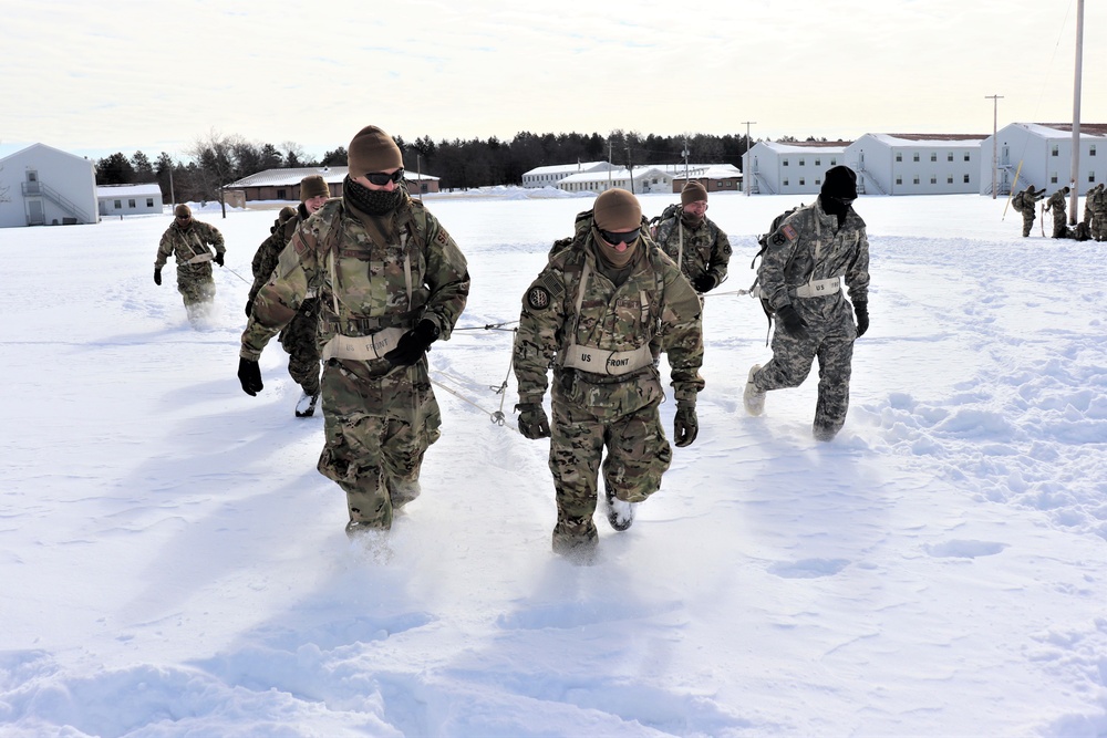 Fort McCoy CWOC Class 20-04 students practice pulling ahkio sled as a squad