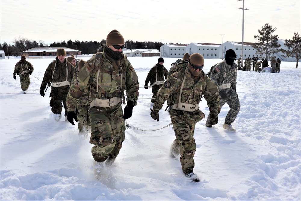 Fort McCoy CWOC Class 20-04 students practice pulling ahkio sled as a squad