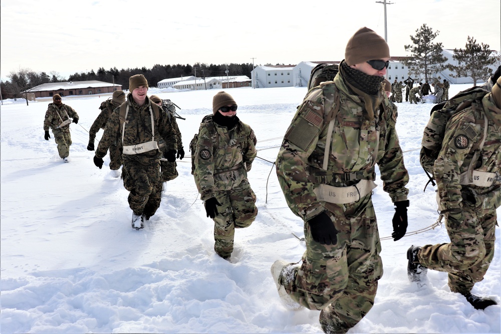 Fort McCoy CWOC Class 20-04 students practice pulling ahkio sled as a squad