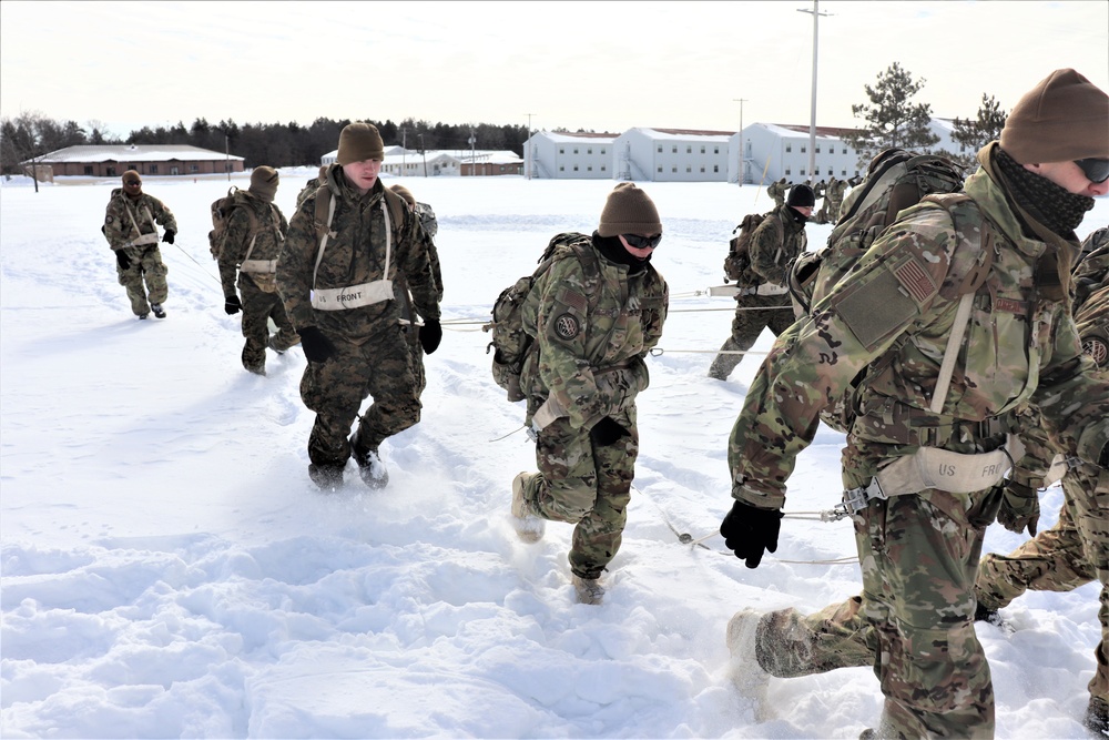 Fort McCoy CWOC Class 20-04 students practice pulling ahkio sled as a squad