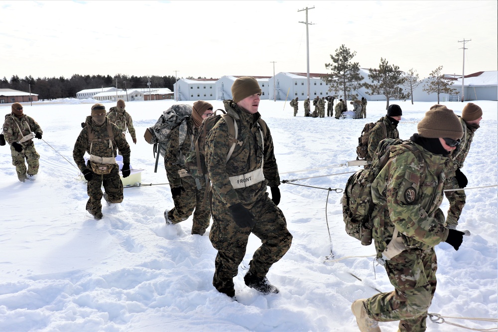 Fort McCoy CWOC Class 20-04 students practice pulling ahkio sled as a squad