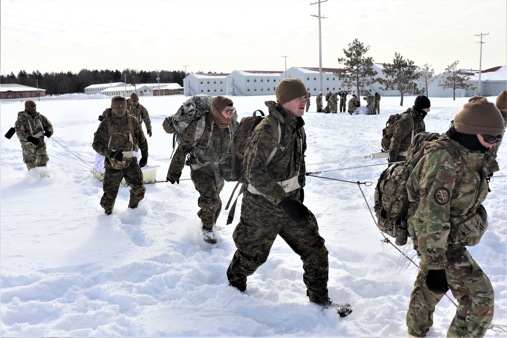 Fort McCoy CWOC Class 20-04 students practice pulling ahkio sled as a squad