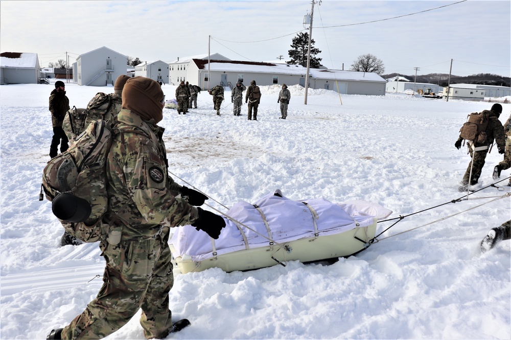 Fort McCoy CWOC Class 20-04 students practice pulling ahkio sled as a squad