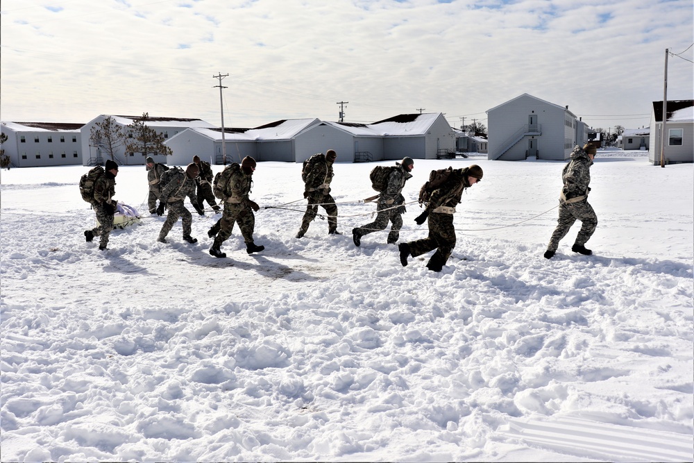 Fort McCoy CWOC Class 20-04 students practice pulling ahkio sled as a squad